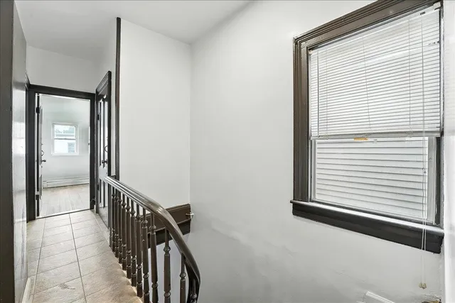 a white toilet sitting next to a bathroom sink