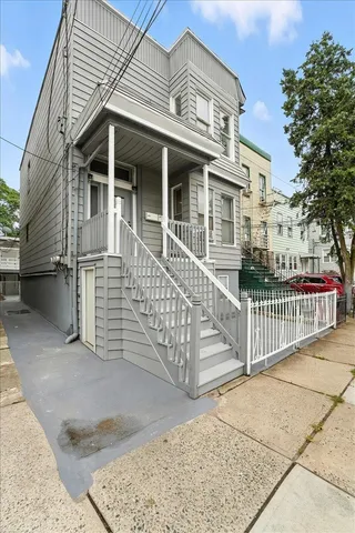 a view of a brick building next to a yard