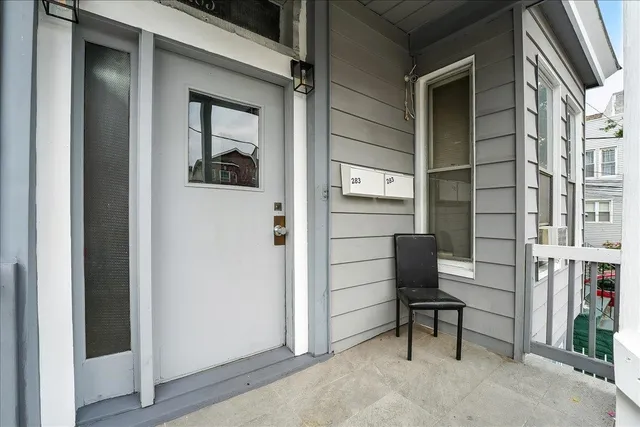 a view of a house with iron fence