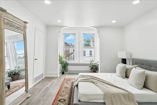 a bed room with a bed and a window