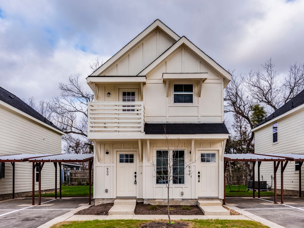 2002 West 2nd Street, Unit 902 Taylor, TX 76574 - Photo 1 of 18 a front view of a house with garden