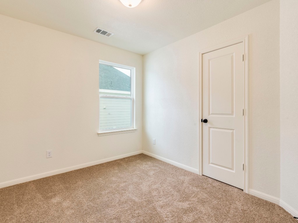 2002 West 2nd Street, Unit 902 Taylor, TX 76574 - Photo 11 of 18 a view of an empty room with a window