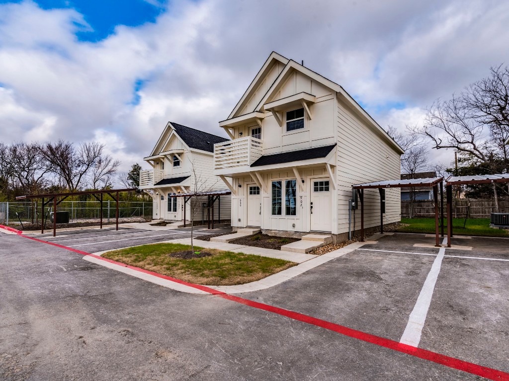 2002 West 2nd Street, Unit 902 Taylor, TX 76574 - Photo 2 of 18 a front view of a house with swimming pool and porch