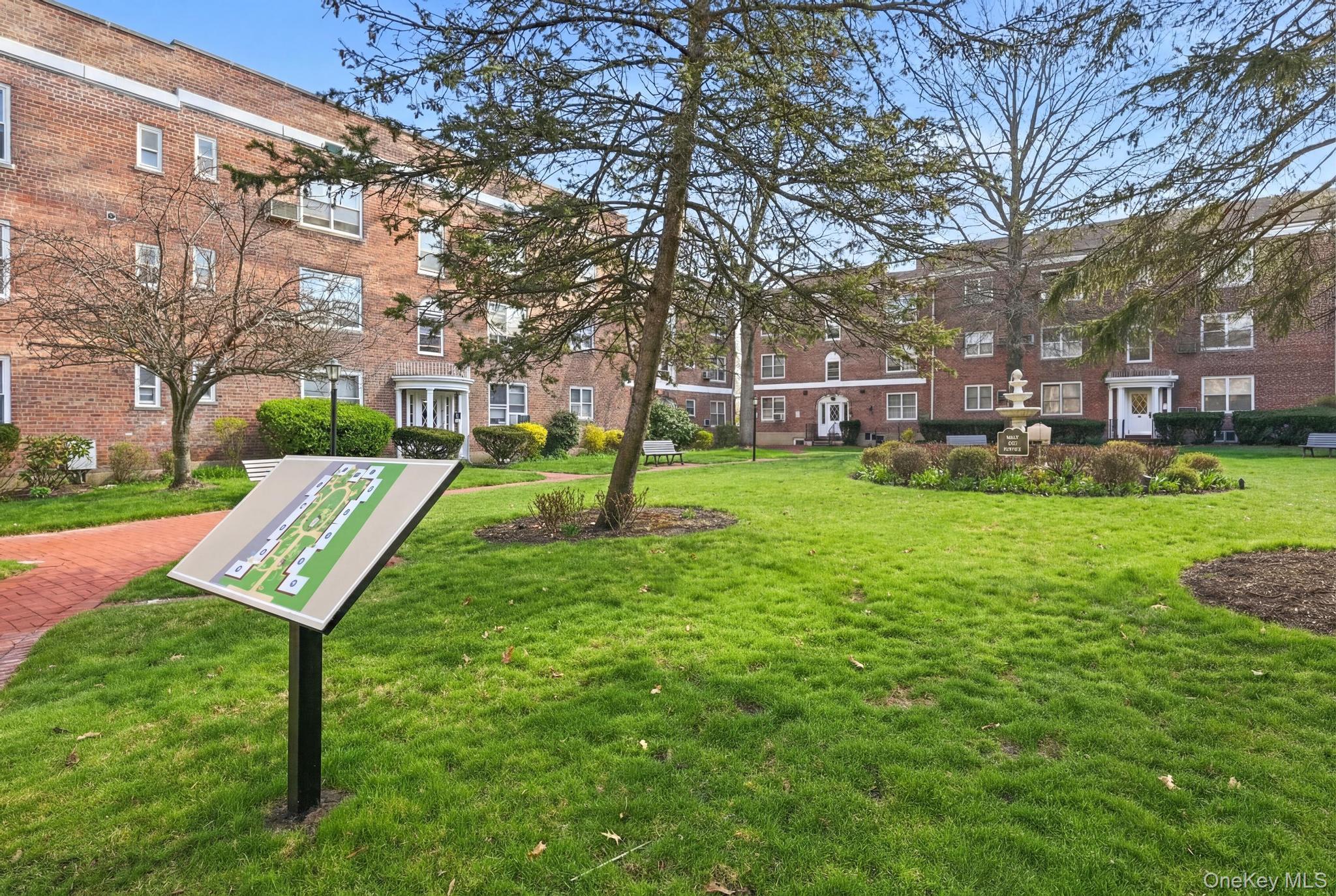 a view of a park with large trees