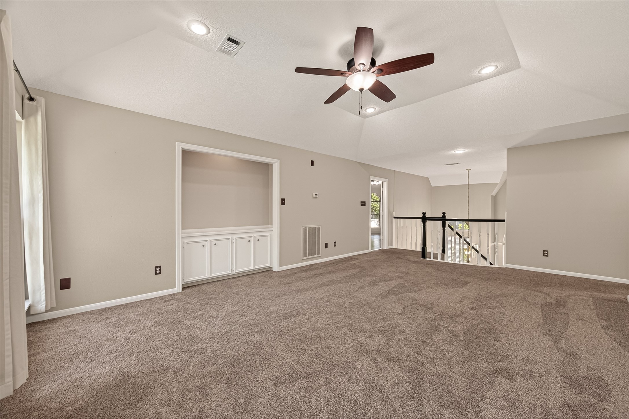 6131 Hampton Way Court Spring, TX 77389 - Photo 26 of 50 a view of an empty room with a ceiling fan