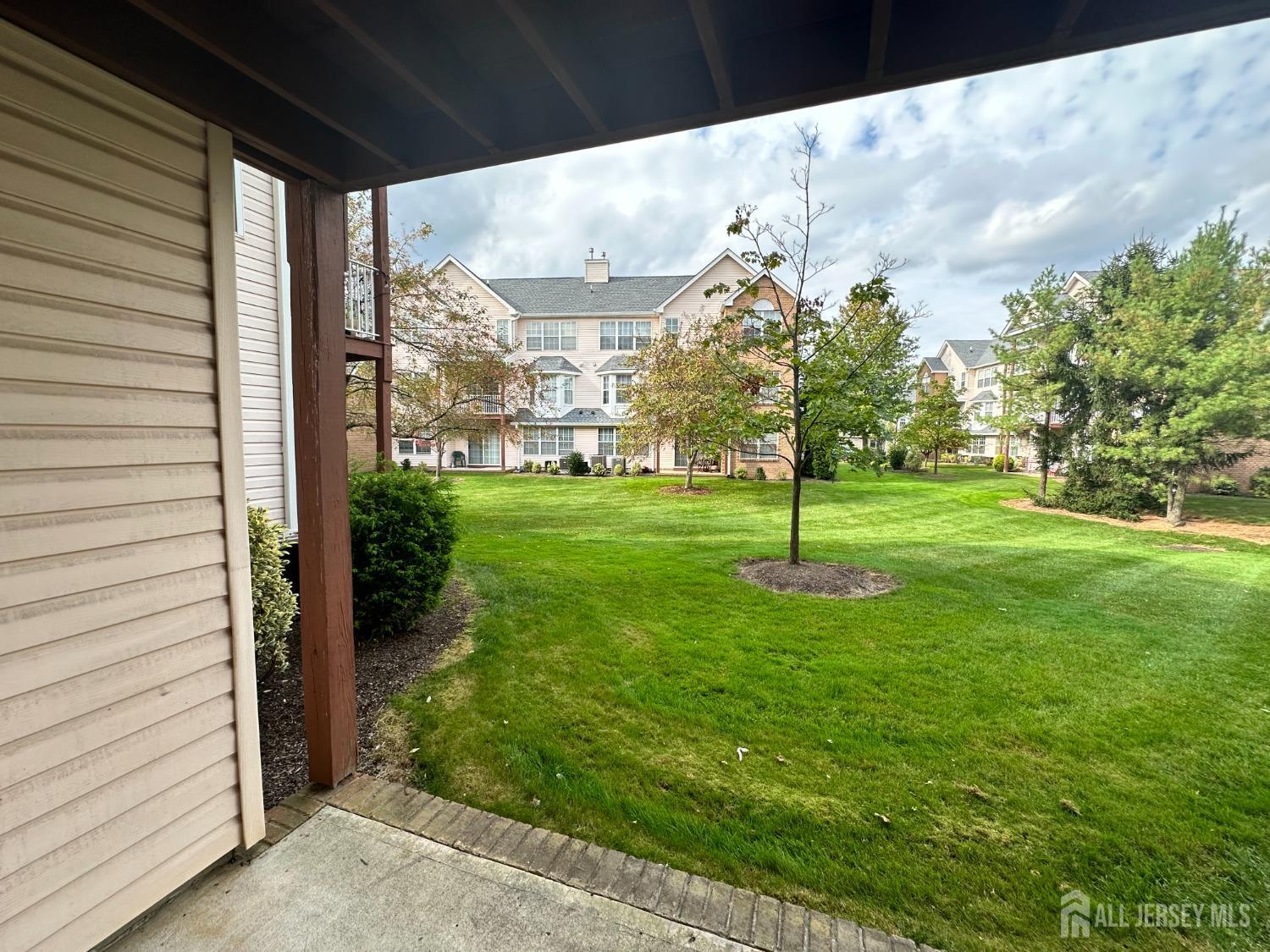 407 Plymouth Road North Brunswick, NJ 08902 - Photo 15 of 16 a view of a garden with a bench