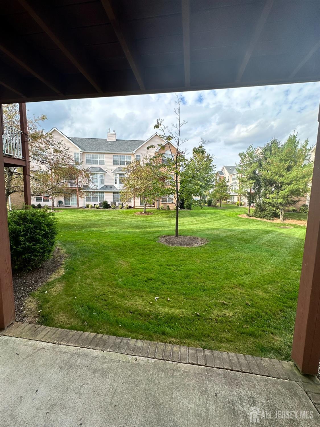 407 Plymouth Road North Brunswick, NJ 08902 - Photo 16 of 16 a view of a big yard with a big tree