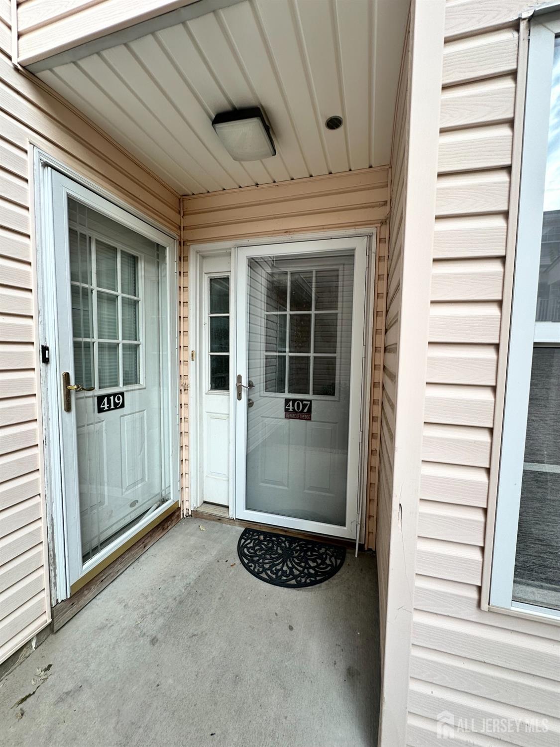 407 Plymouth Road North Brunswick, NJ 08902 - Photo 2 of 16 a view of entryway with a front door