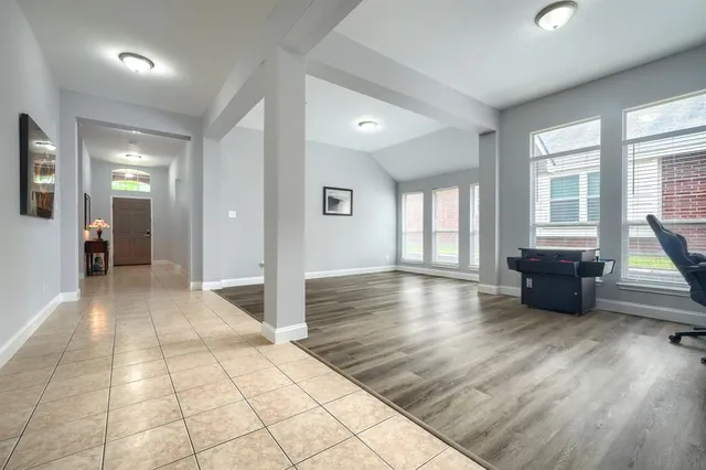 a view of livingroom with hardwood floor and a ceiling fan