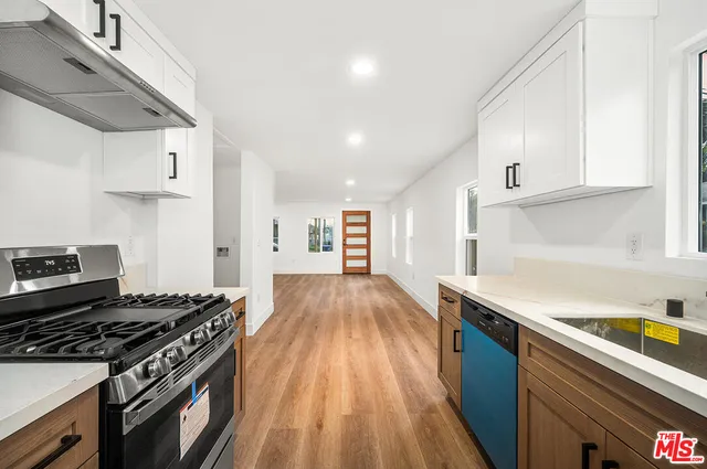 a kitchen with a stove and a refrigerator