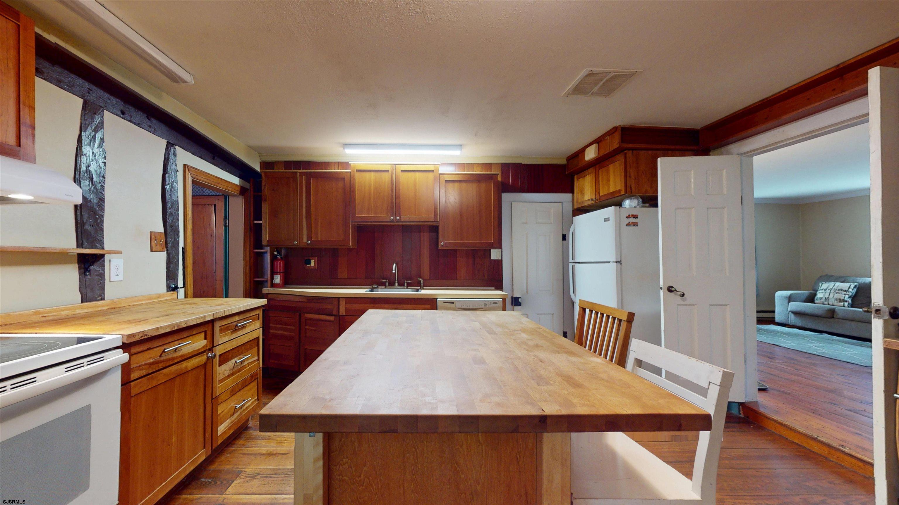 216 Old New York Road Port Republic, NJ 08241 - Photo 14 of 70 a large kitchen with kitchen island a sink stove and refrigerator