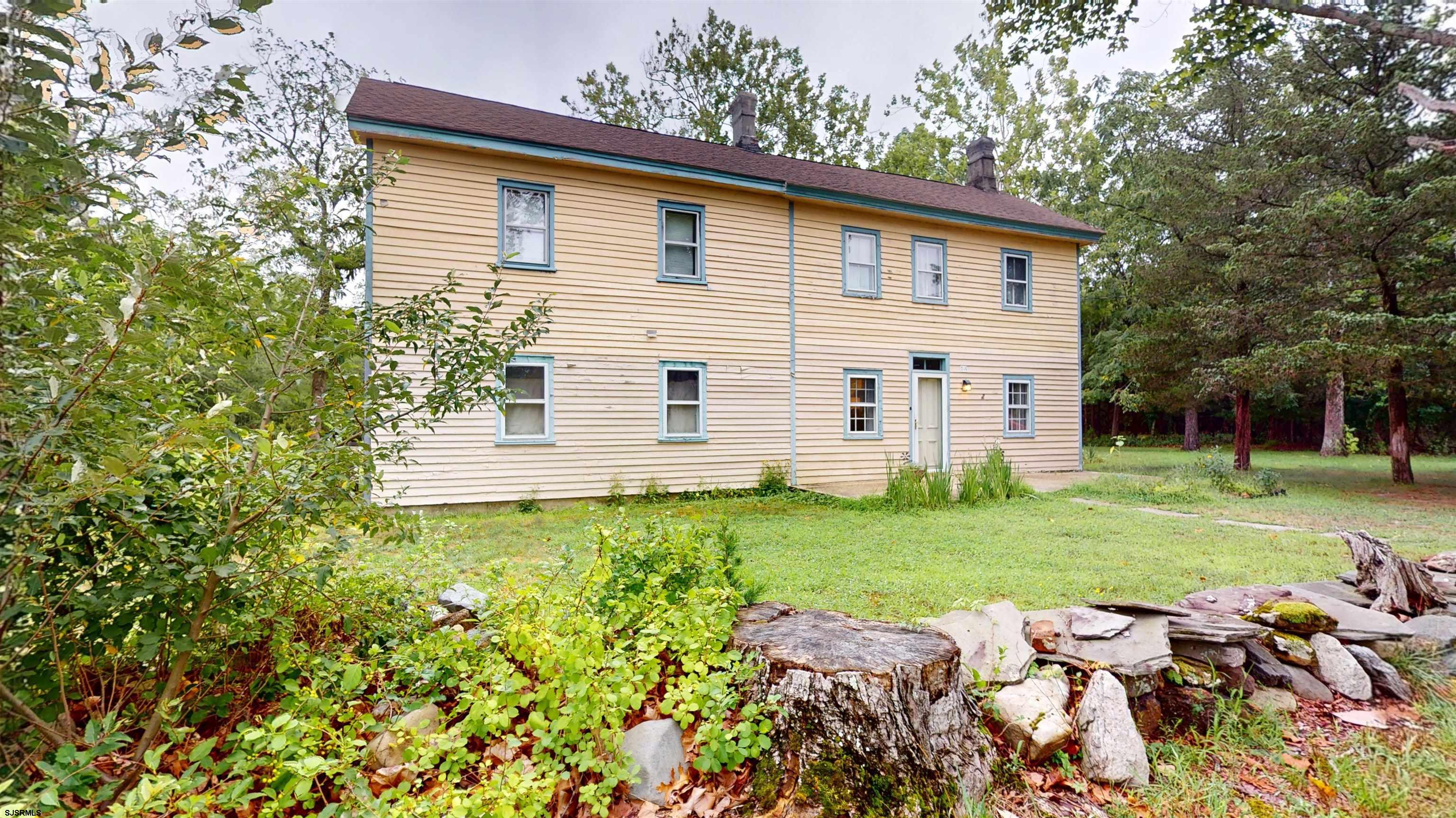 216 Old New York Road Port Republic, NJ 08241 - Photo 3 of 70 a view of a backyard with plants and large trees