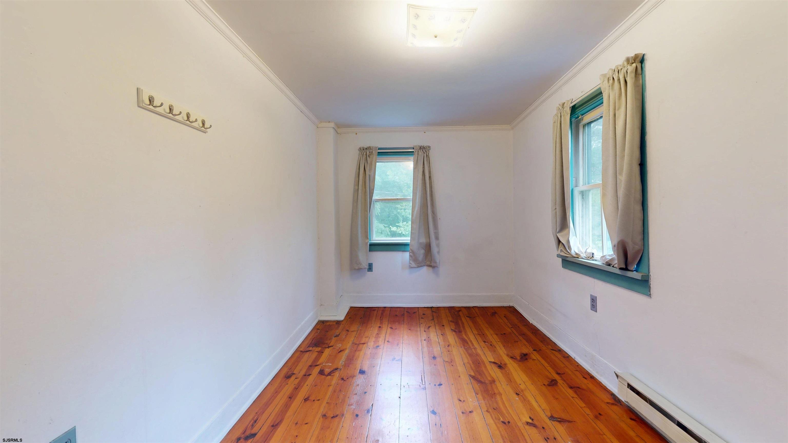 216 Old New York Road Port Republic, NJ 08241 - Photo 31 of 70 an empty room with wooden floor and windows