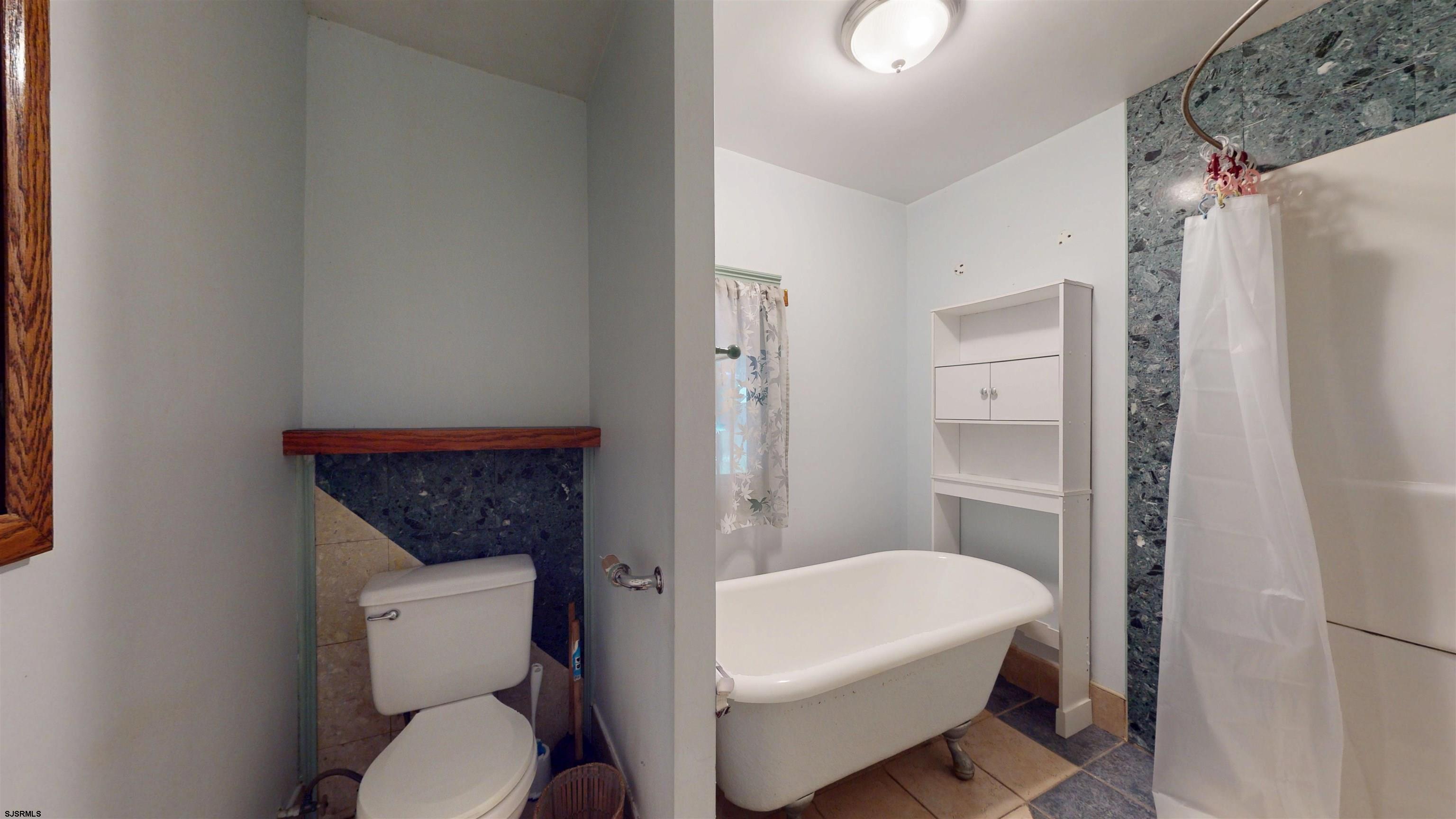216 Old New York Road Port Republic, NJ 08241 - Photo 39 of 70 a white toilet sitting next to a white tub