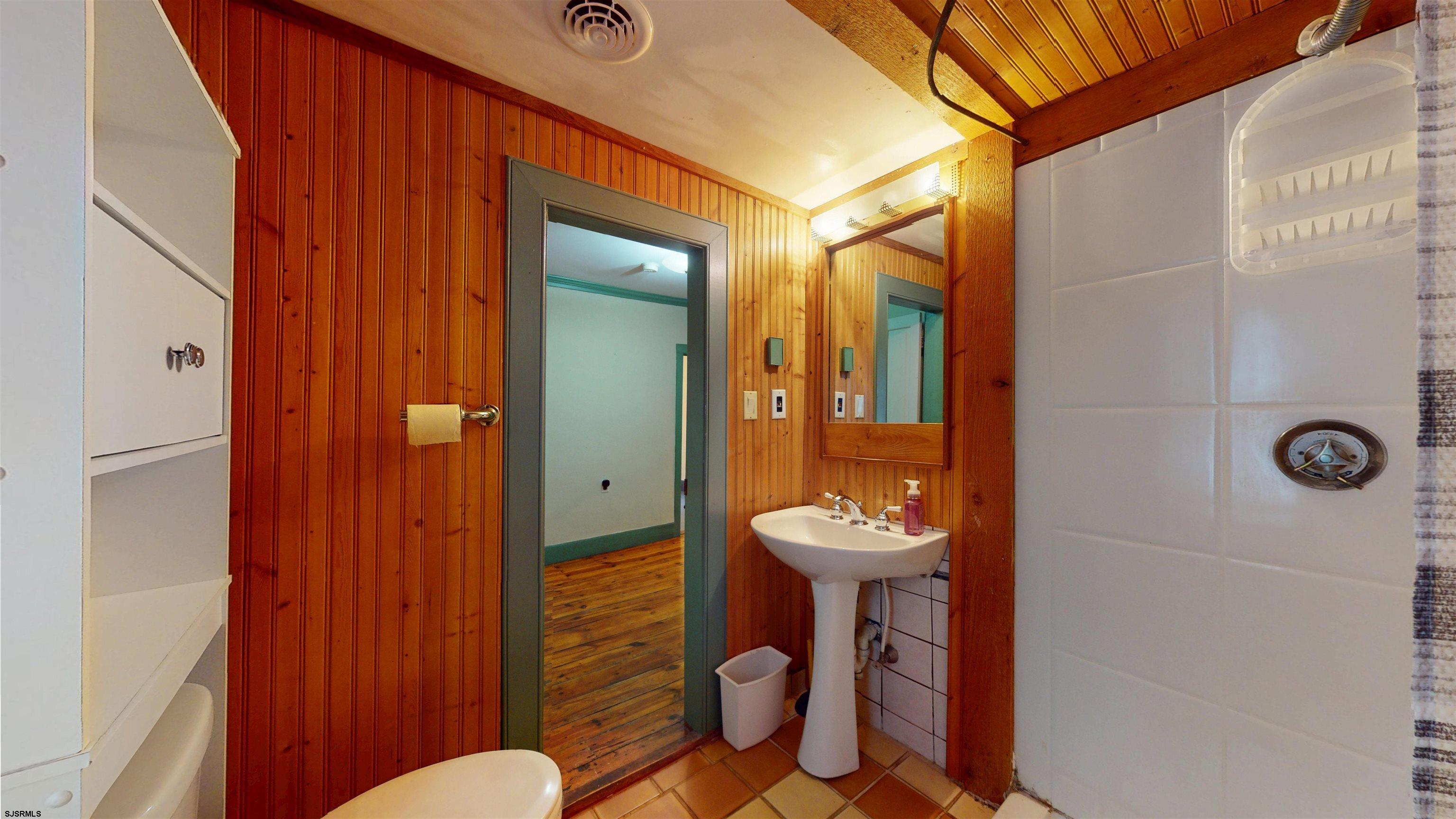 216 Old New York Road Port Republic, NJ 08241 - Photo 42 of 70 a bathroom with a sink mirror toilet and shower