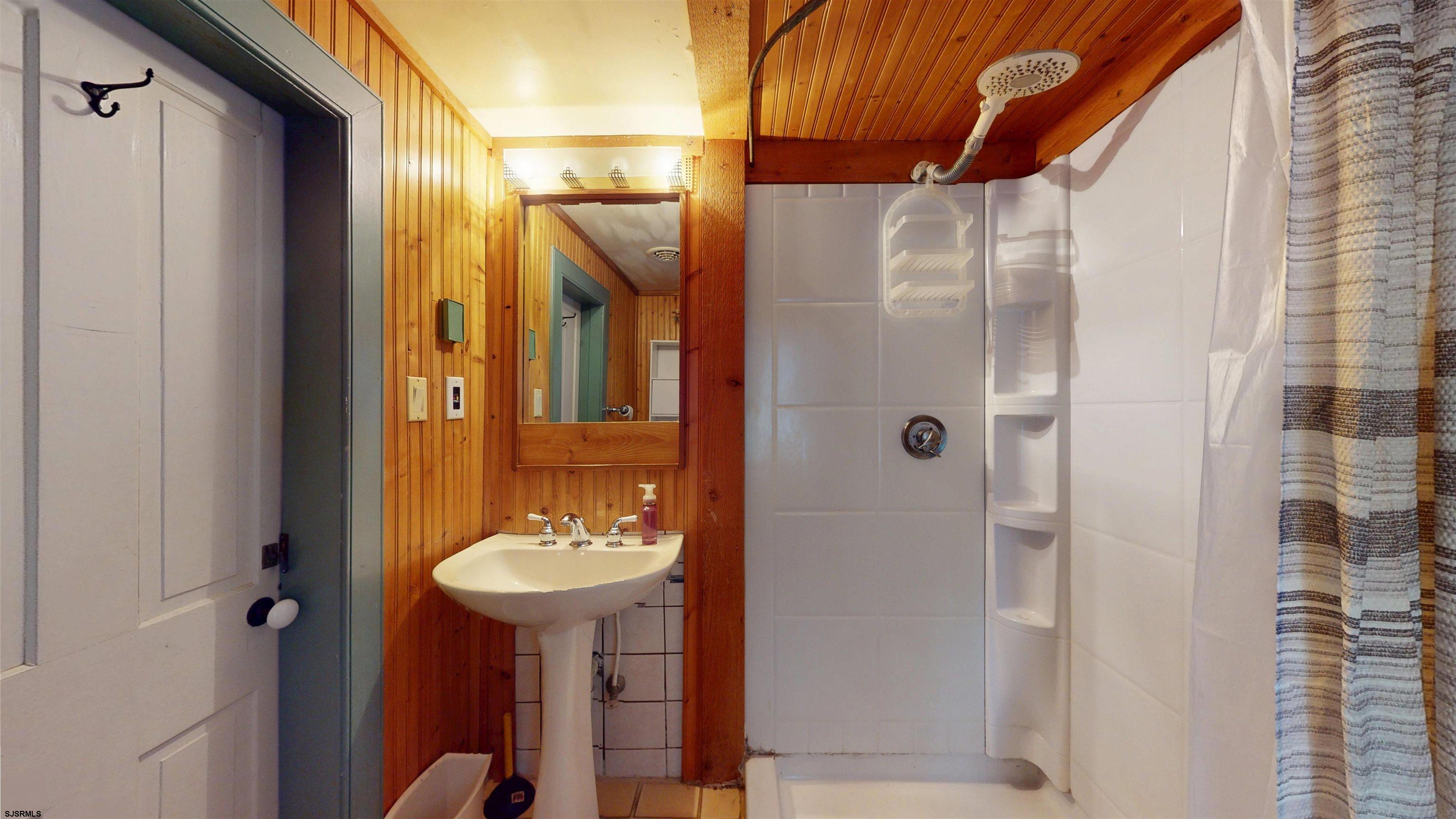 216 Old New York Road Port Republic, NJ 08241 - Photo 43 of 70 a bathroom with a sink shower and a mirror