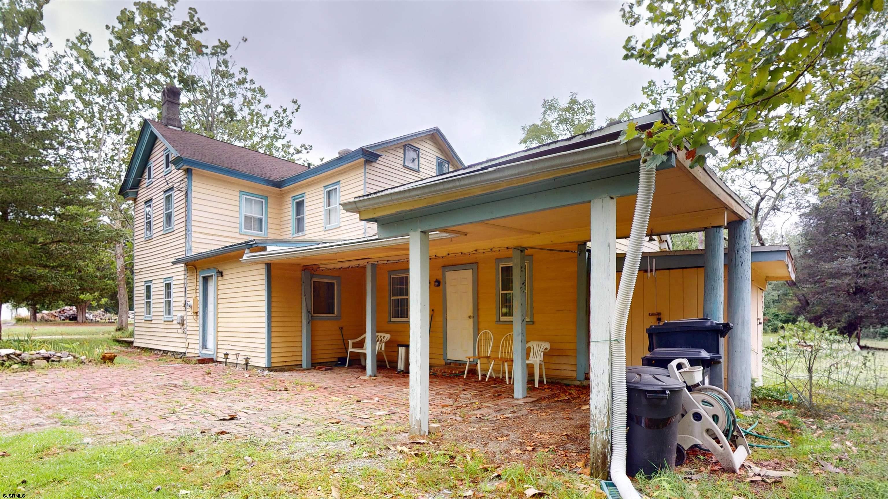 216 Old New York Road Port Republic, NJ 08241 - Photo 45 of 70 a backyard of a house with barbeque oven table and chairs