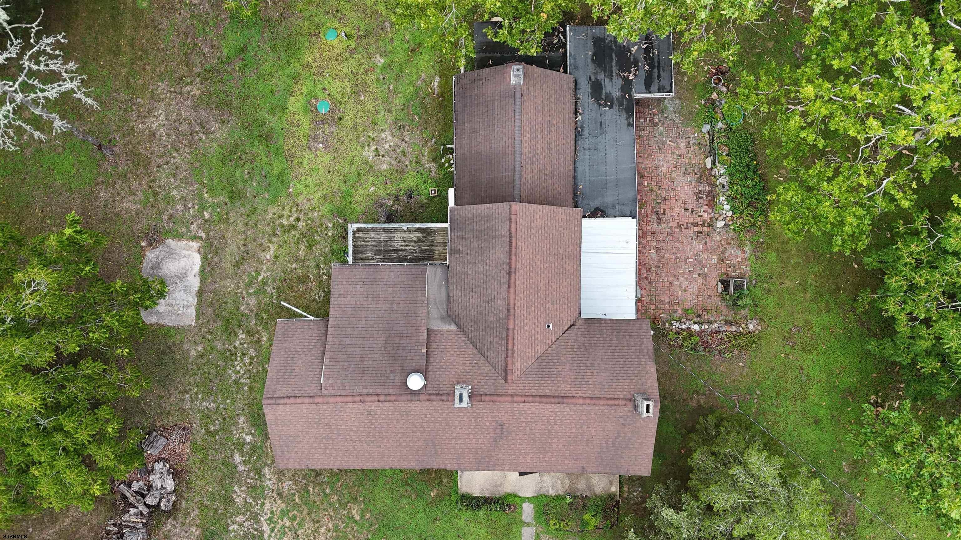 216 Old New York Road Port Republic, NJ 08241 - Photo 59 of 70 an aerial view of a house with a yard and large trees
