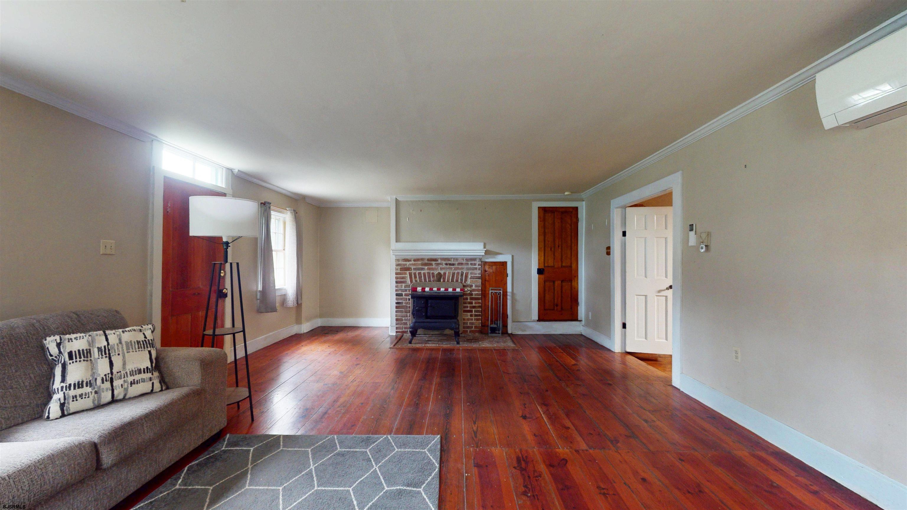 216 Old New York Road Port Republic, NJ 08241 - Photo 6 of 70 a view of a livingroom with furniture wooden floor and a fireplace