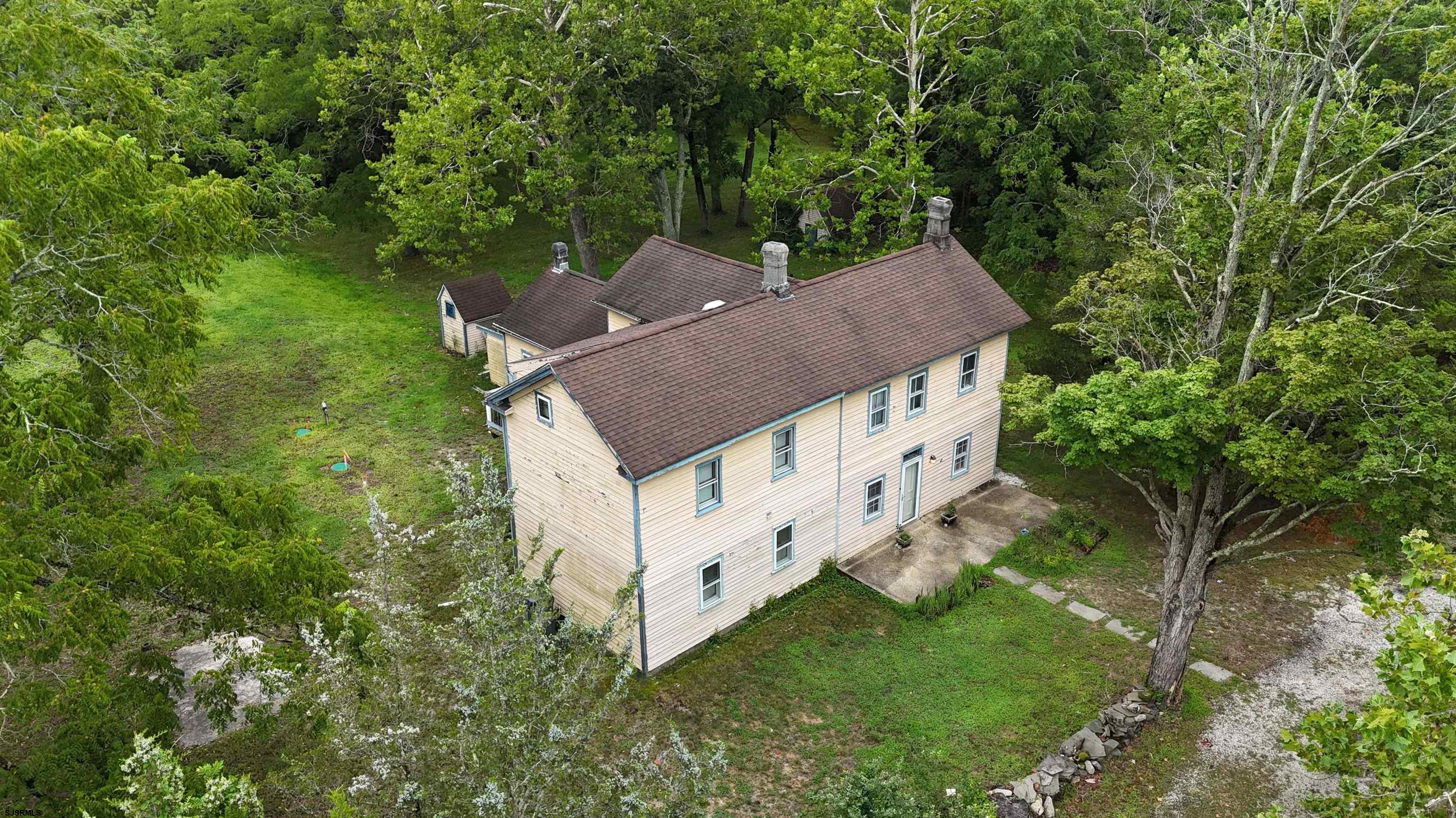216 Old New York Road Port Republic, NJ 08241 - Photo 63 of 70 an aerial view of a house with yard and trees in the background