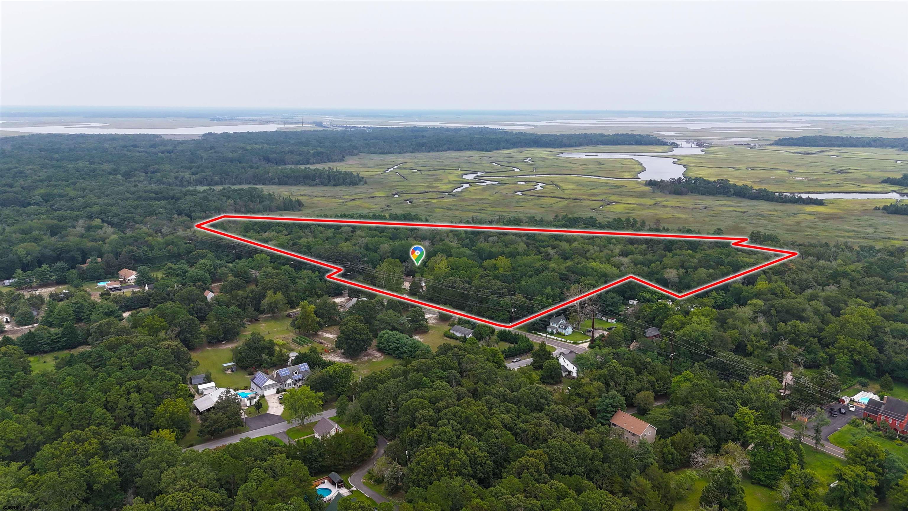 216 Old New York Road Port Republic, NJ 08241 - Photo 67 of 70 an aerial view of a residential houses with outdoor space and ocean view