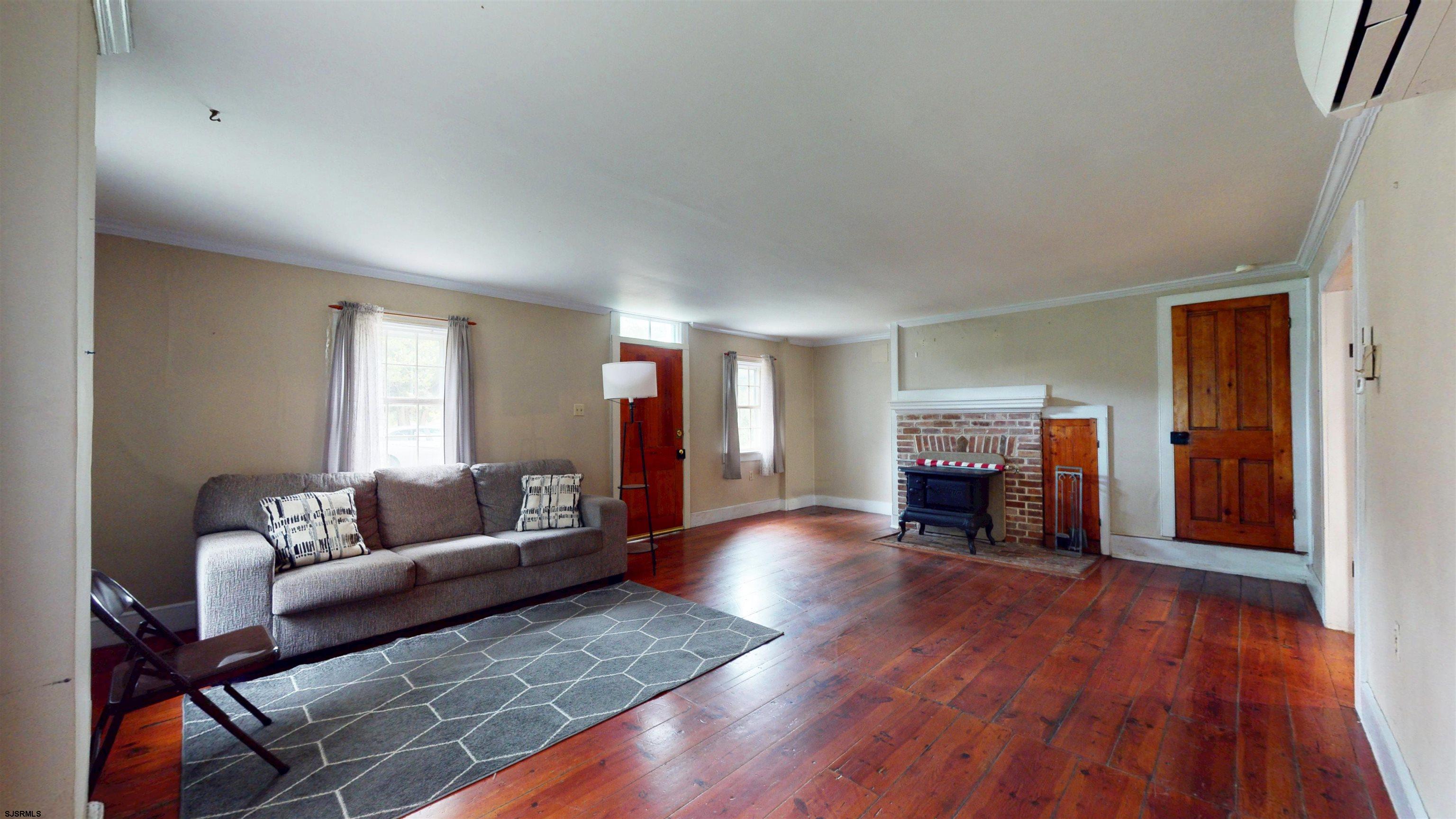 216 Old New York Road Port Republic, NJ 08241 - Photo 7 of 70 a living room with furniture and a fireplace