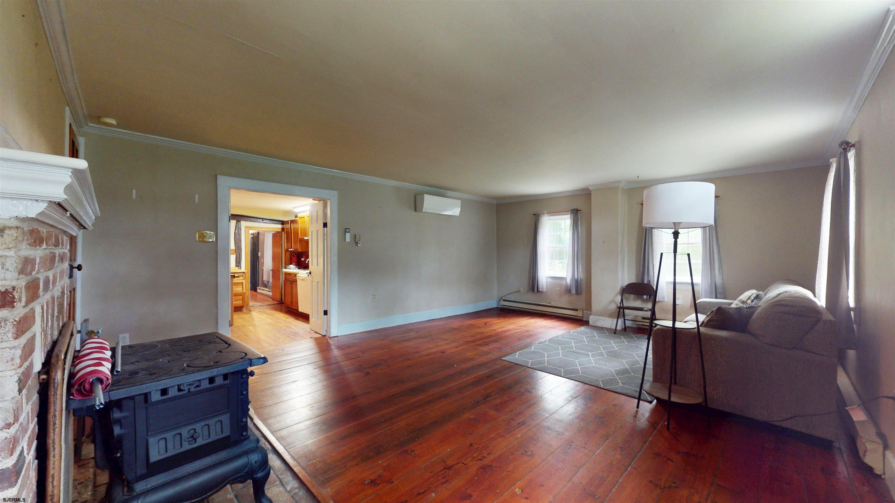 216 Old New York Road Port Republic, NJ 08241 - Photo 9 of 70 a living room with furniture fireplace and wooden floor