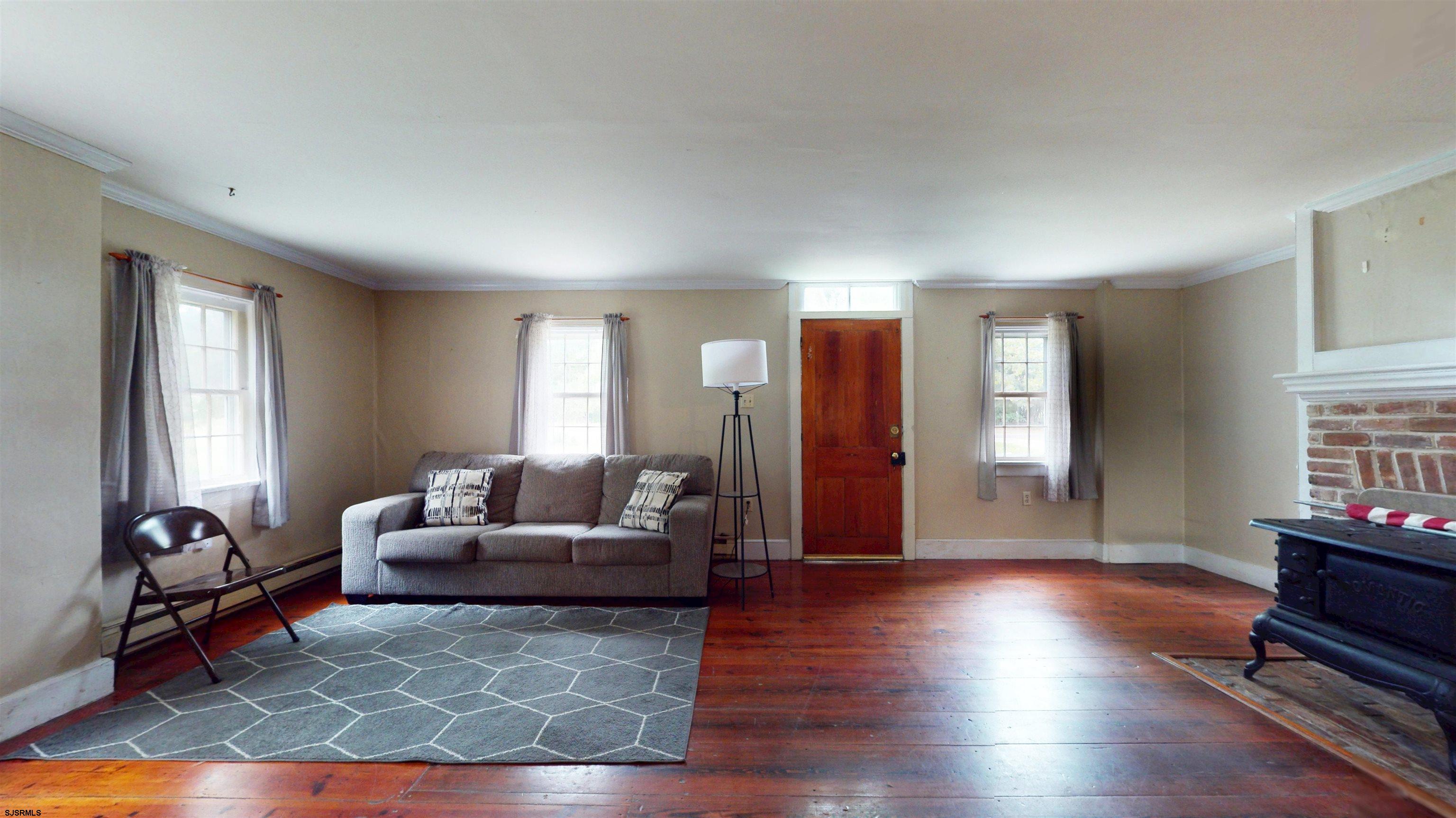 216 Old New York Road Port Republic, NJ 08241 - Photo 10 of 70 a living room with furniture window and wooden floor