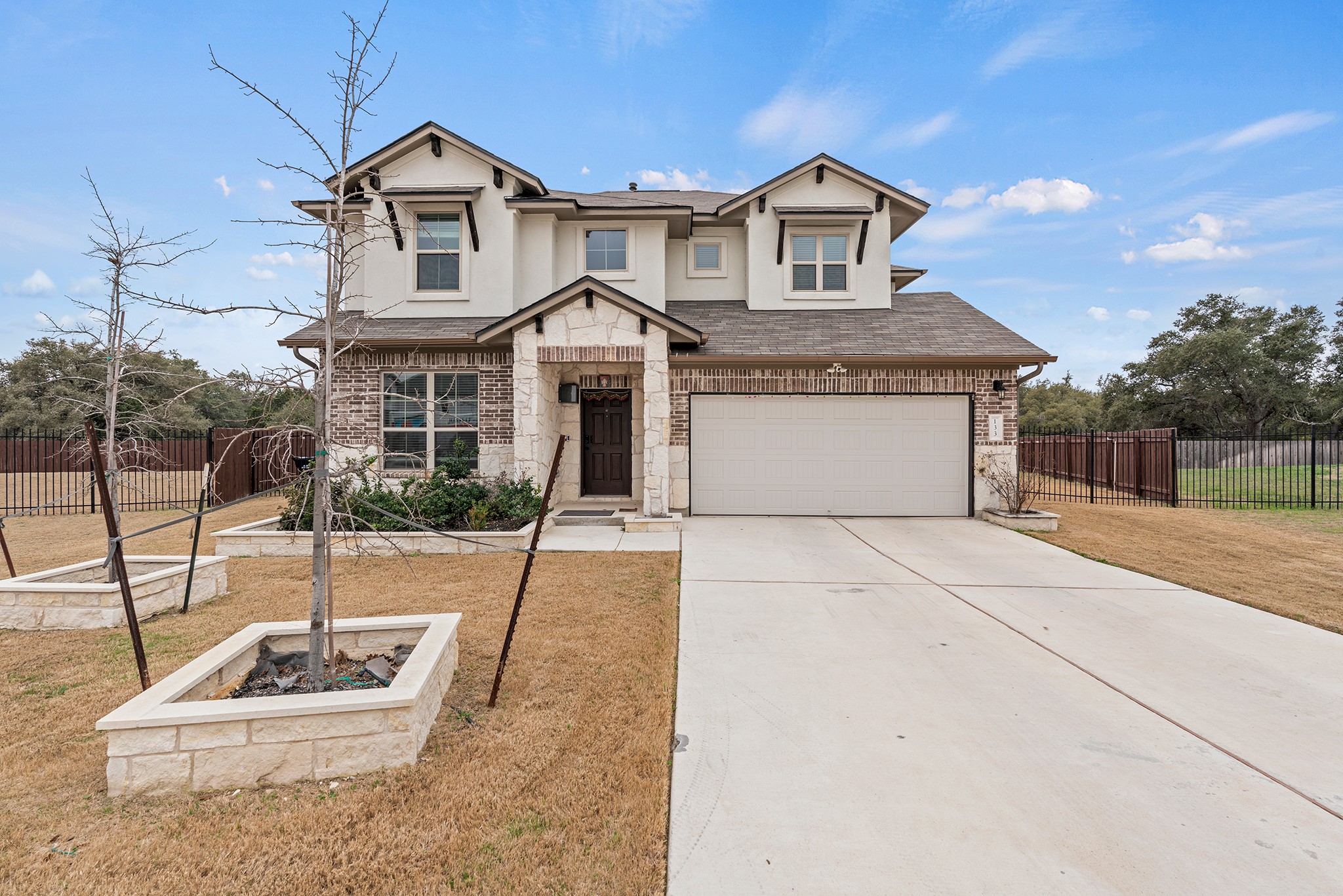 133 Caney Cove Leander, TX 78641 - Photo 1 of 30 View of front facade featuring driveway, a shingled roof, a garage, and fence