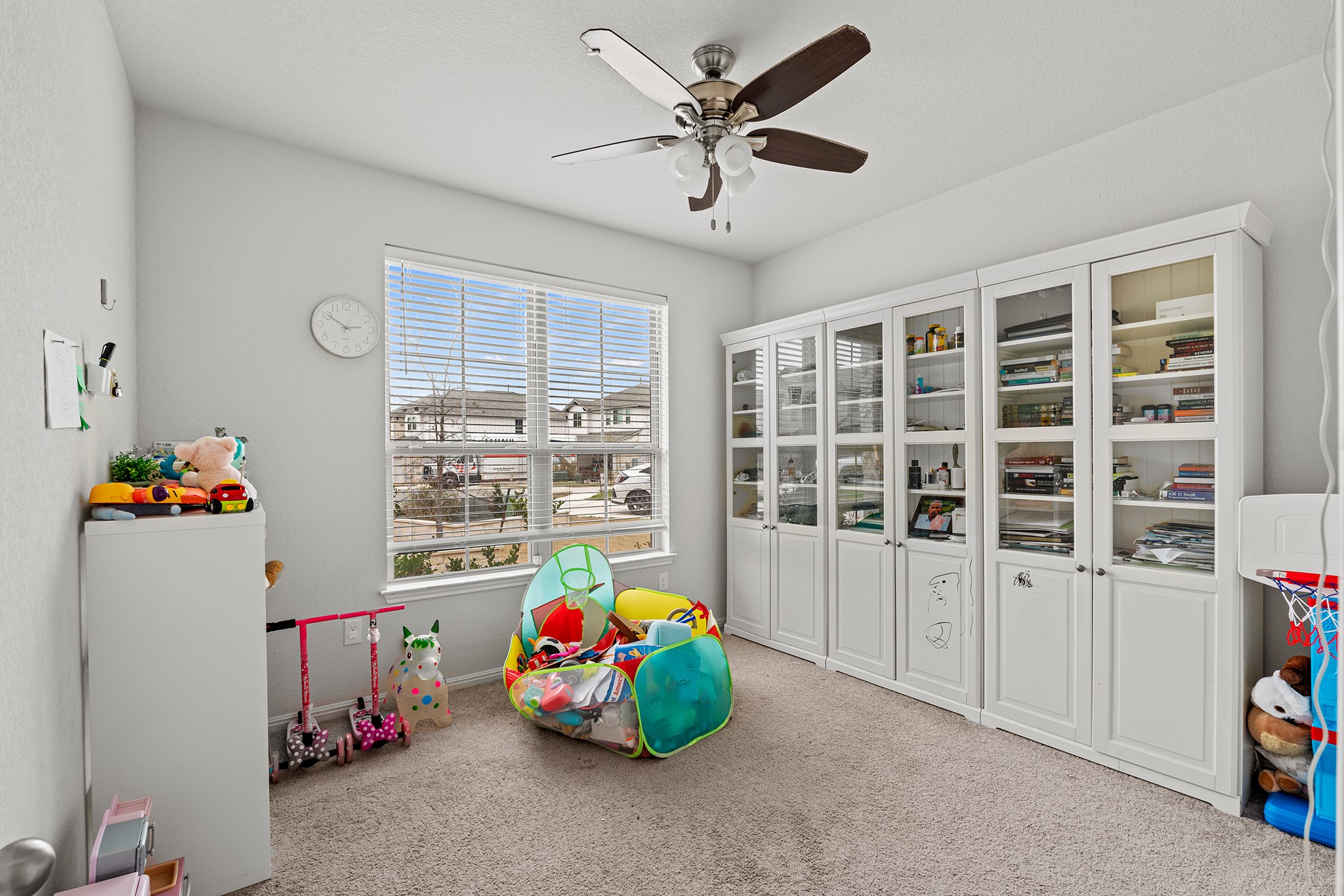 133 Caney Cove Leander, TX 78641 - Photo 11 of 30 Playroom with ceiling fan and carpet