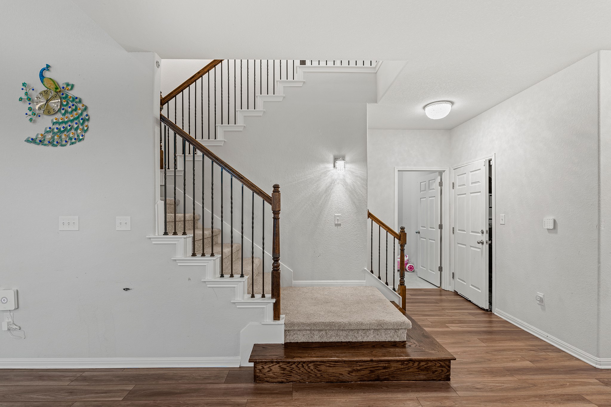 133 Caney Cove Leander, TX 78641 - Photo 14 of 30 Entryway featuring stairway, baseboards, and wood finished floors