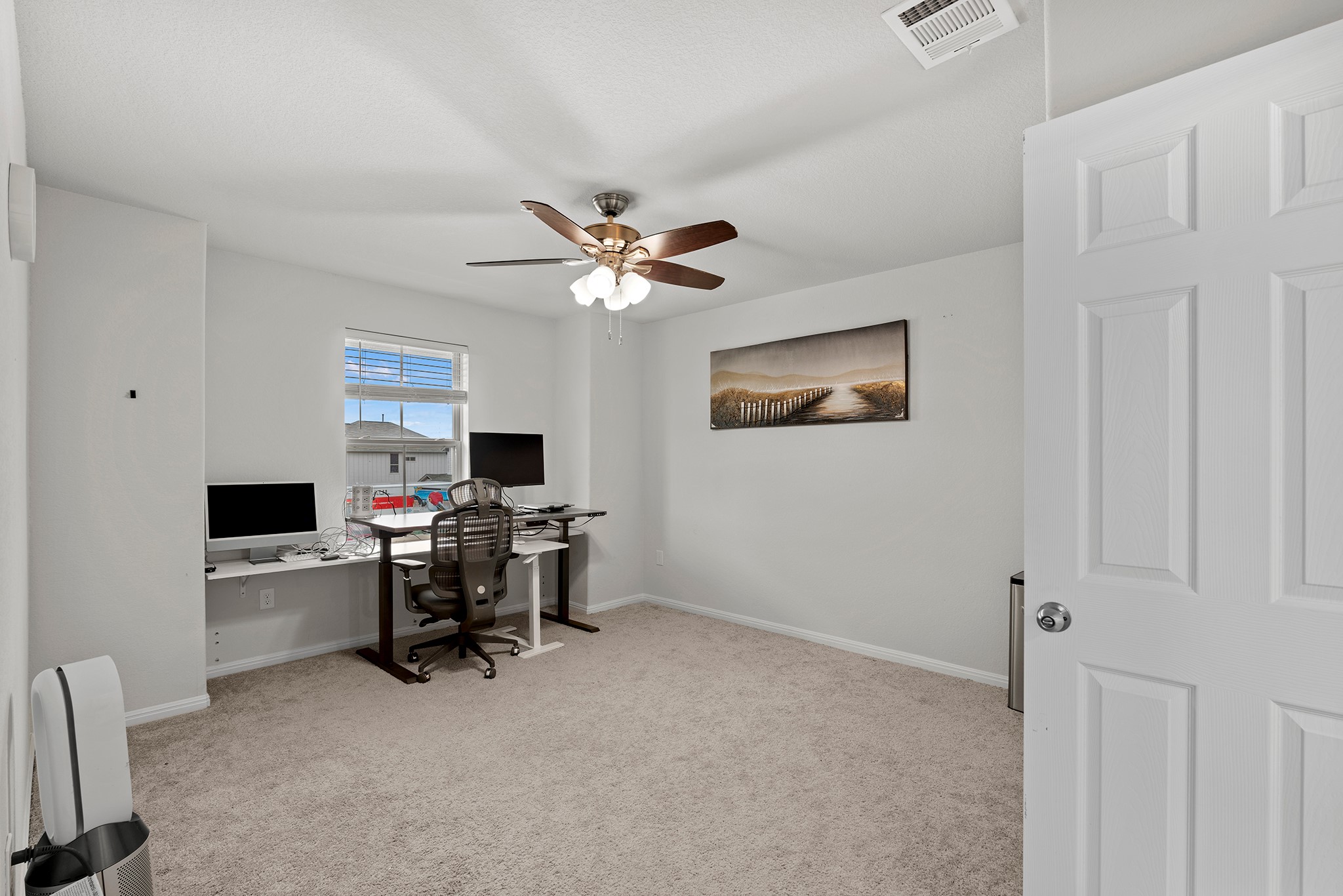 133 Caney Cove Leander, TX 78641 - Photo 19 of 30 Office area featuring baseboards, visible vents, ceiling fan, and carpet flooring