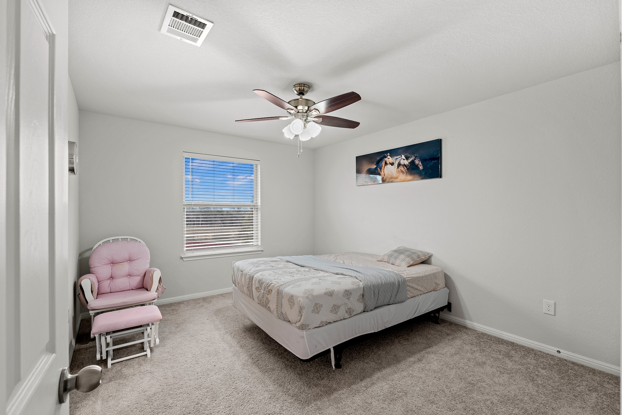 133 Caney Cove Leander, TX 78641 - Photo 23 of 30 Carpeted bedroom featuring ceiling fan, visible vents, and baseboards