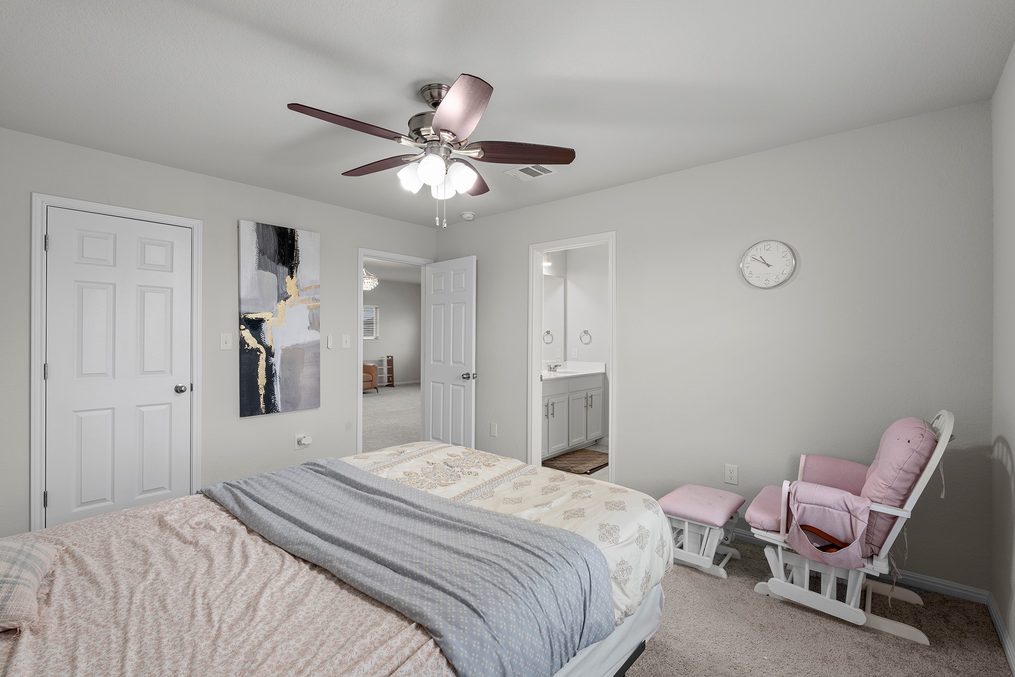133 Caney Cove Leander, TX 78641 - Photo 24 of 30 Carpeted bedroom featuring a ceiling fan, baseboards, visible vents, and connected bathroom