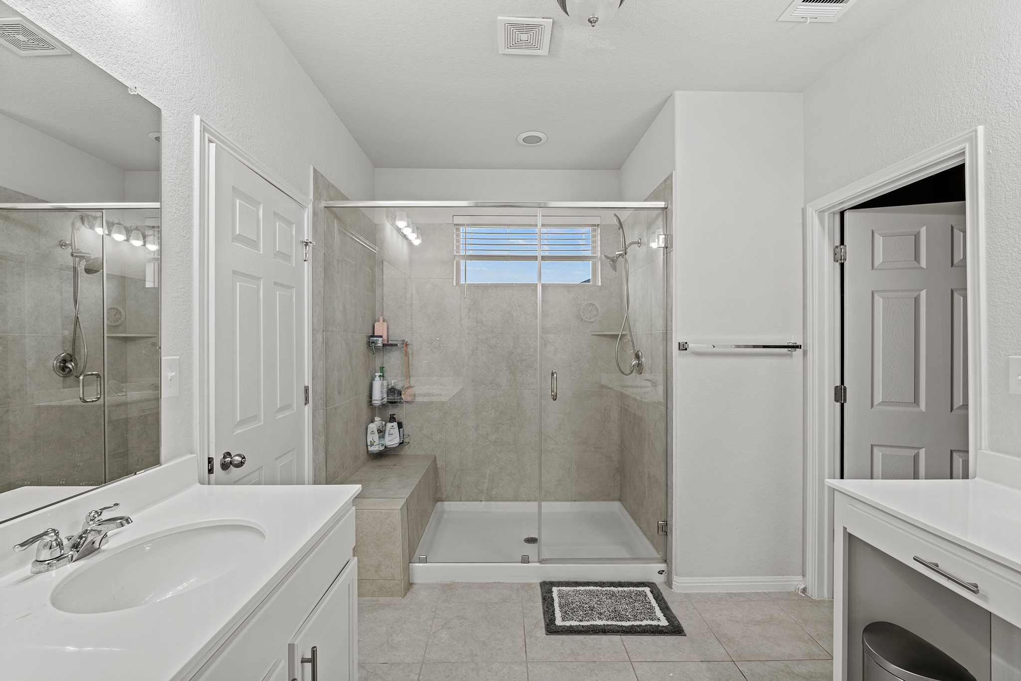 133 Caney Cove Leander, TX 78641 - Photo 9 of 30 Full bathroom featuring a stall shower, visible vents, tile patterned flooring, and vanity