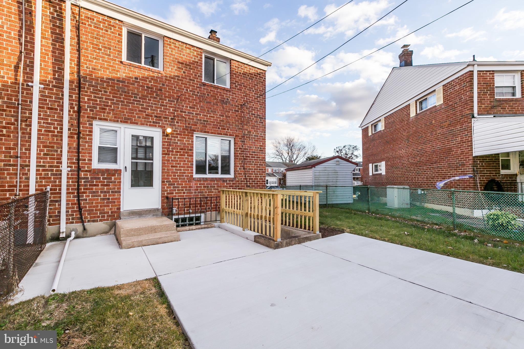 7808 Charlesmont Road Baltimore, MD 21222 - Photo 30 of 32 a front view of a house with a yard
