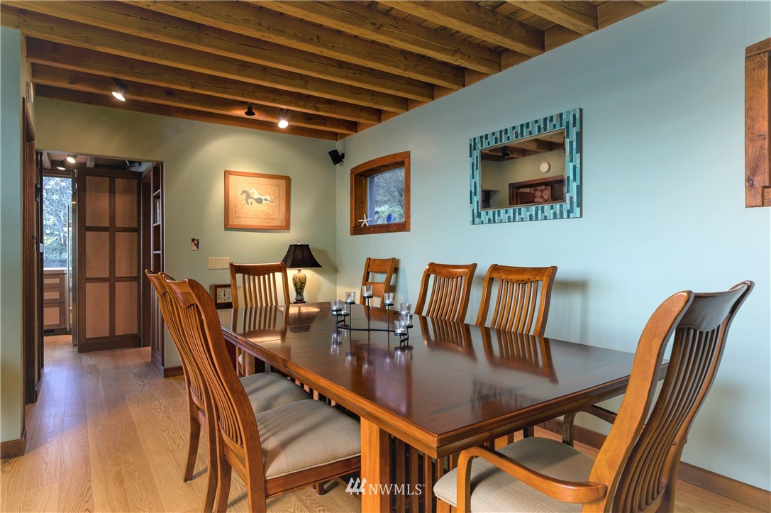14114 Ervine Road Anacortes, WA 98221 - Photo 14 of 40 a dining room with furniture a rug and wooden floor