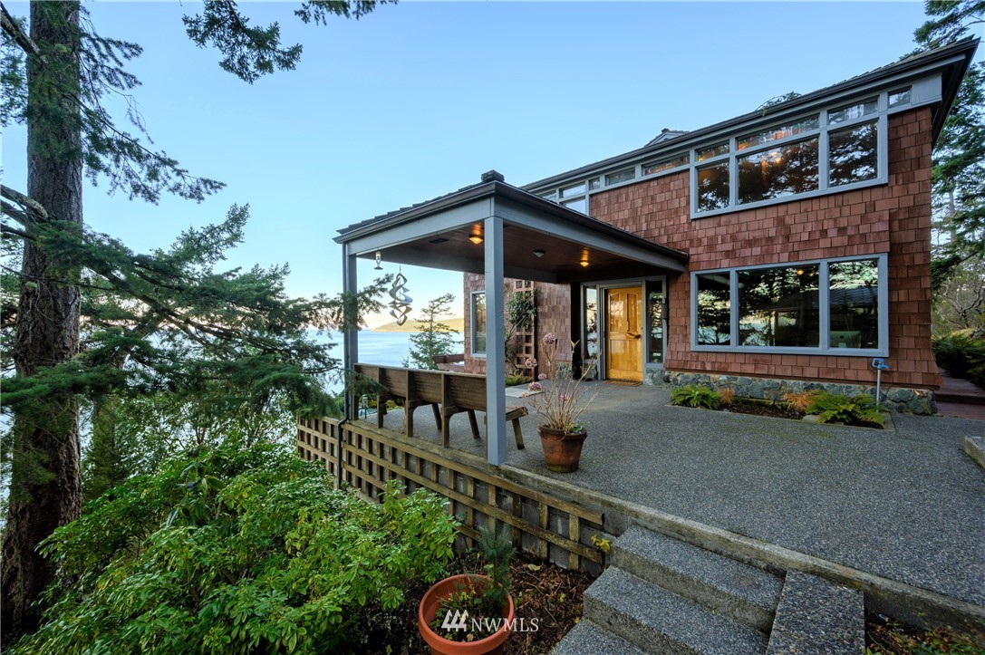 14114 Ervine Road Anacortes, WA 98221 - Photo 22 of 40 a front view of a house with porch and furniture