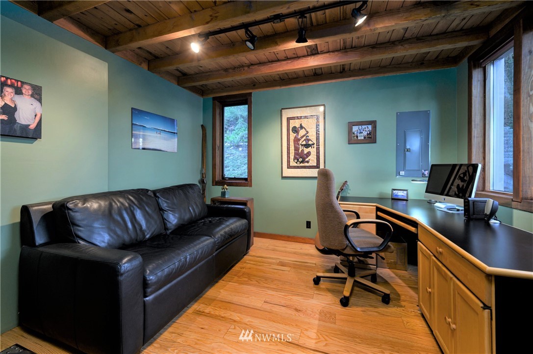 14114 Ervine Road Anacortes, WA 98221 - Photo 25 of 40 a view of a livingroom with workspace and a couch