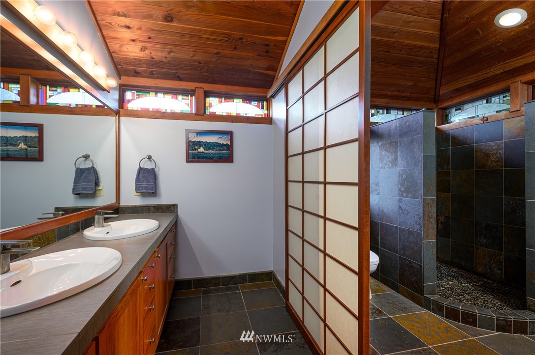 14114 Ervine Road Anacortes, WA 98221 - Photo 27 of 40 a bathroom with a sink and mirror