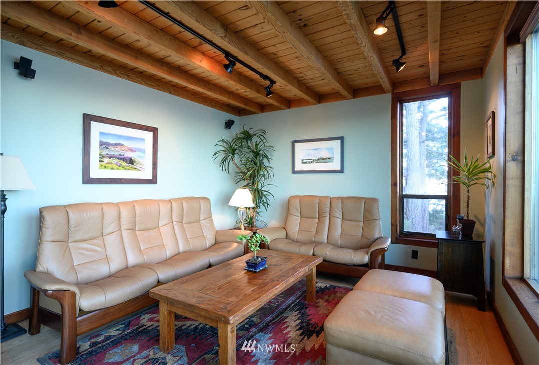 14114 Ervine Road Anacortes, WA 98221 - Photo 30 of 40 a living room with furniture and a night stand