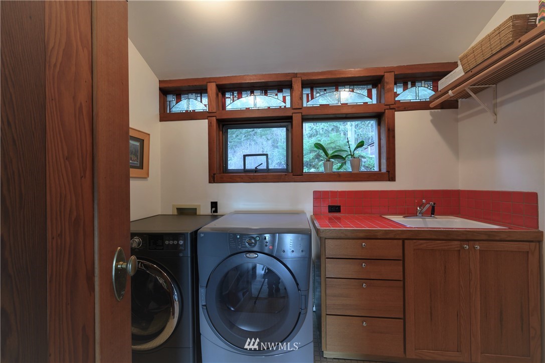 14114 Ervine Road Anacortes, WA 98221 - Photo 33 of 40 a utility room with a sink dryer and washer