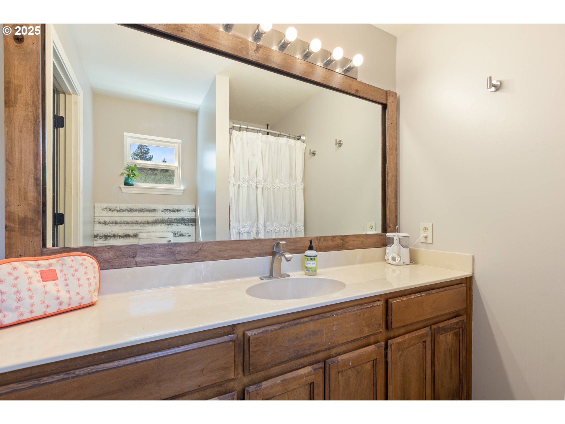 187 Hackett Lane Riddle, OR 97469 - Photo 13 of 48 a bathroom with a sink and a mirror