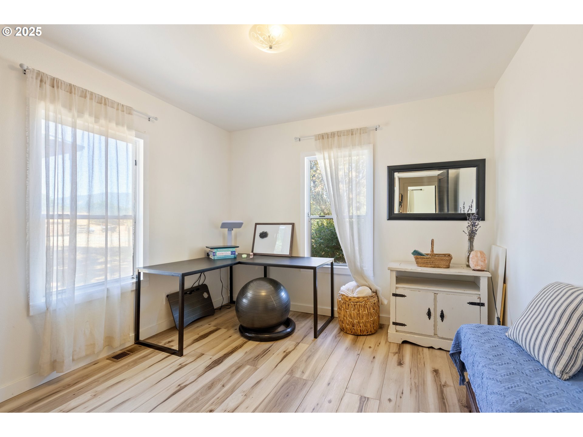 187 Hackett Lane Riddle, OR 97469 - Photo 14 of 48 a bedroom with a bed and a desk