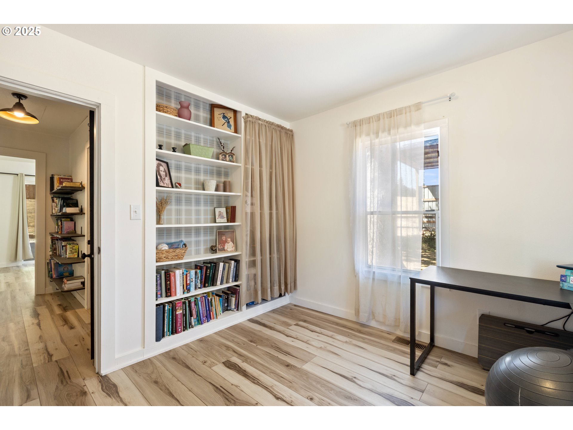 187 Hackett Lane Riddle, OR 97469 - Photo 15 of 48 a room with a book shelf and a window