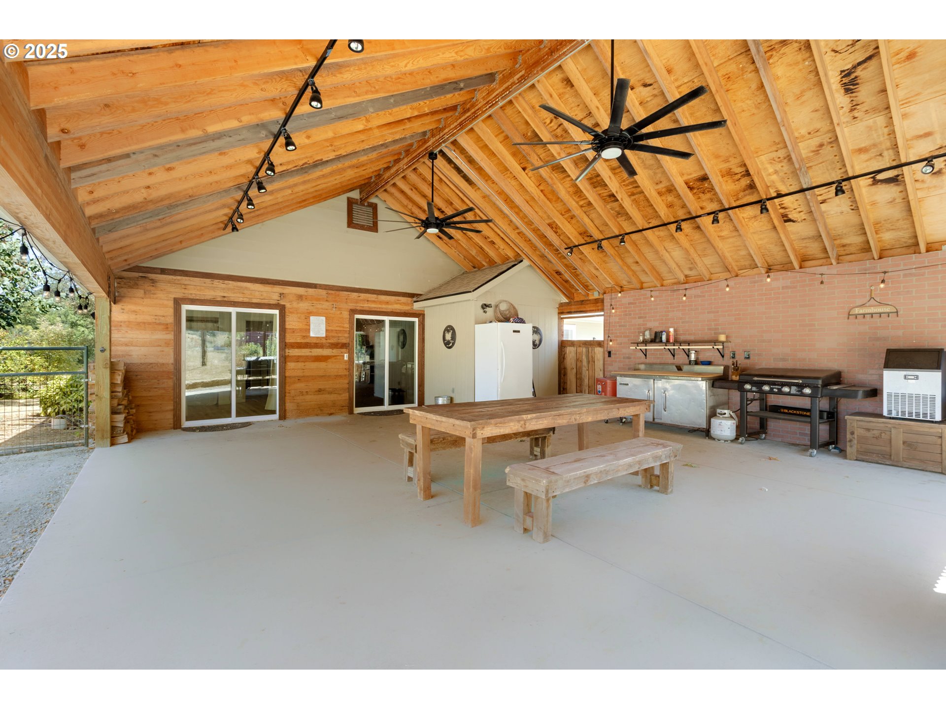 187 Hackett Lane Riddle, OR 97469 - Photo 24 of 48 a view of a backyard with furniture and a roof