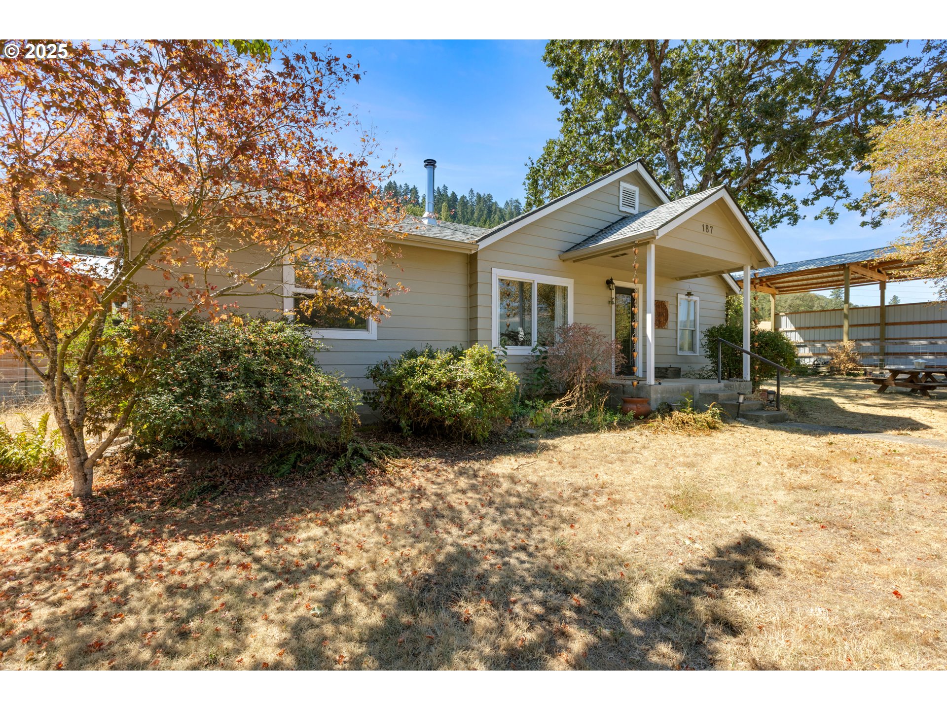 187 Hackett Lane Riddle, OR 97469 - Photo 30 of 48 a view of a house with a yard