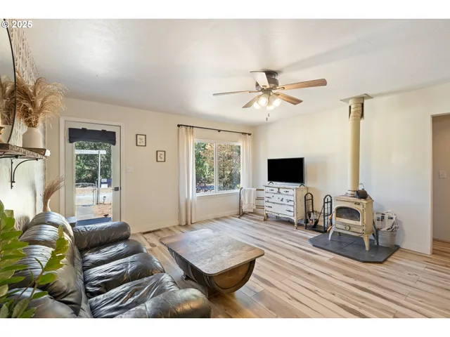 a living room with furniture fireplace and a flat screen tv