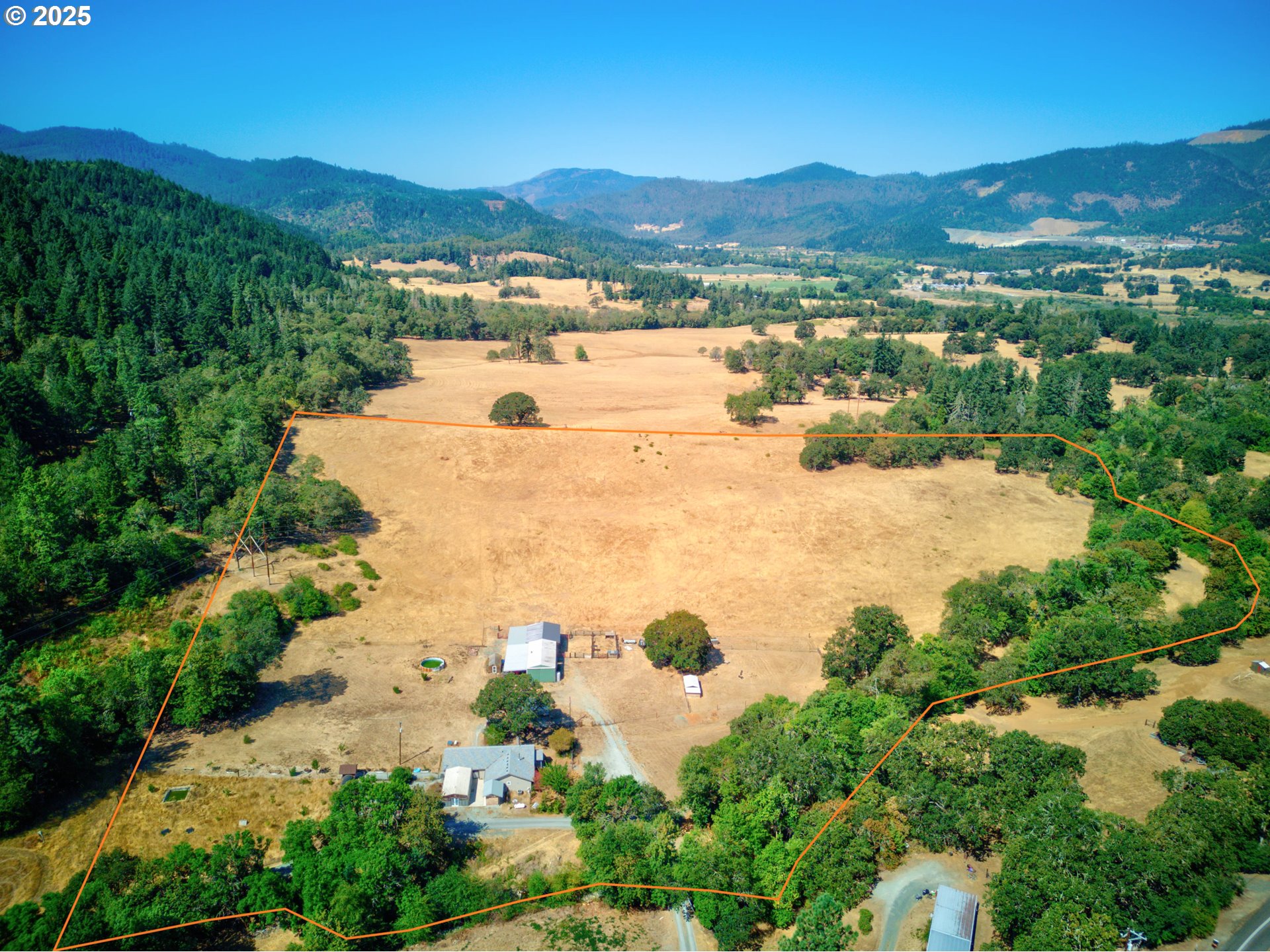 187 Hackett Lane Riddle, OR 97469 - Photo 43 of 48 an aerial view of residential houses with outdoor space and trees