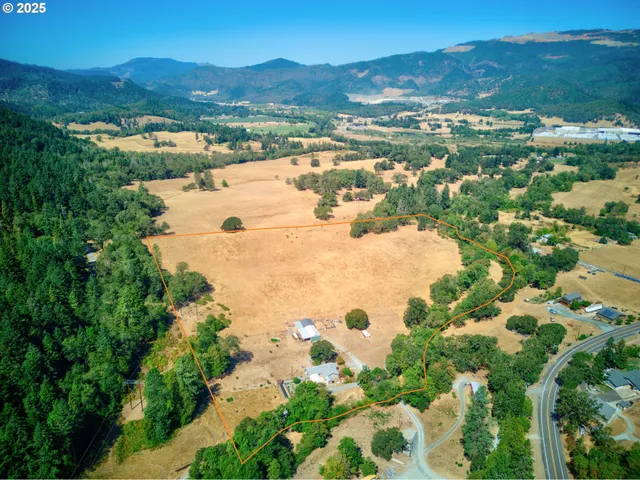 a view of a city with mountains in the background